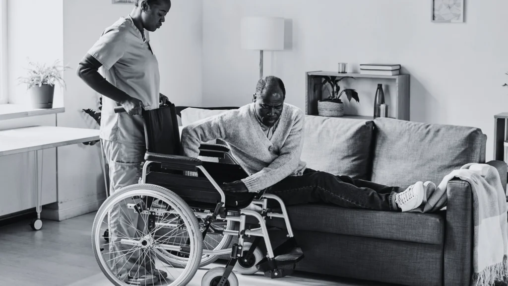 in house care assisting patient into wheel chair